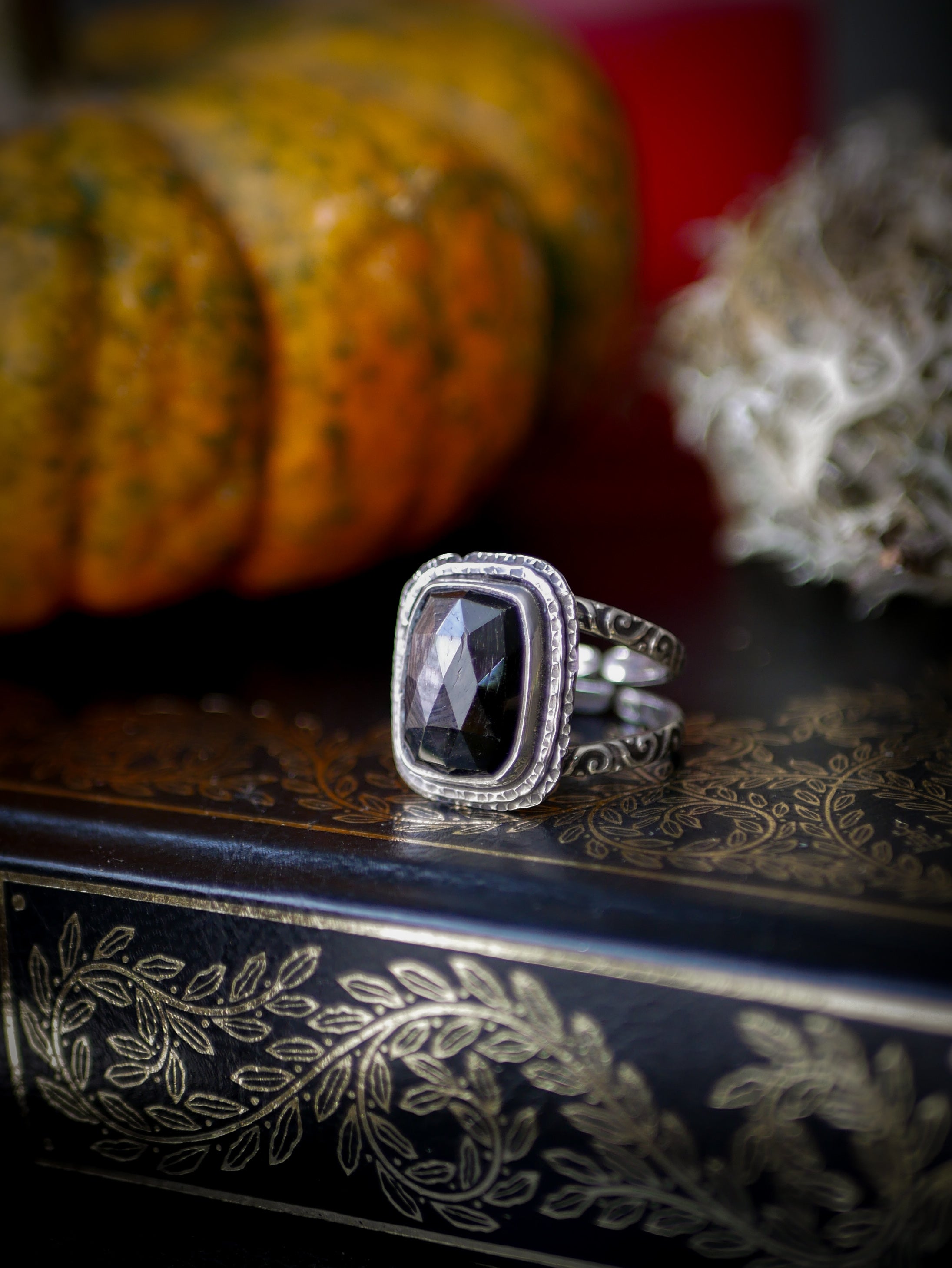 Persephone's Gate - Faceted hypersthene and silver ring, forged skull on the back
