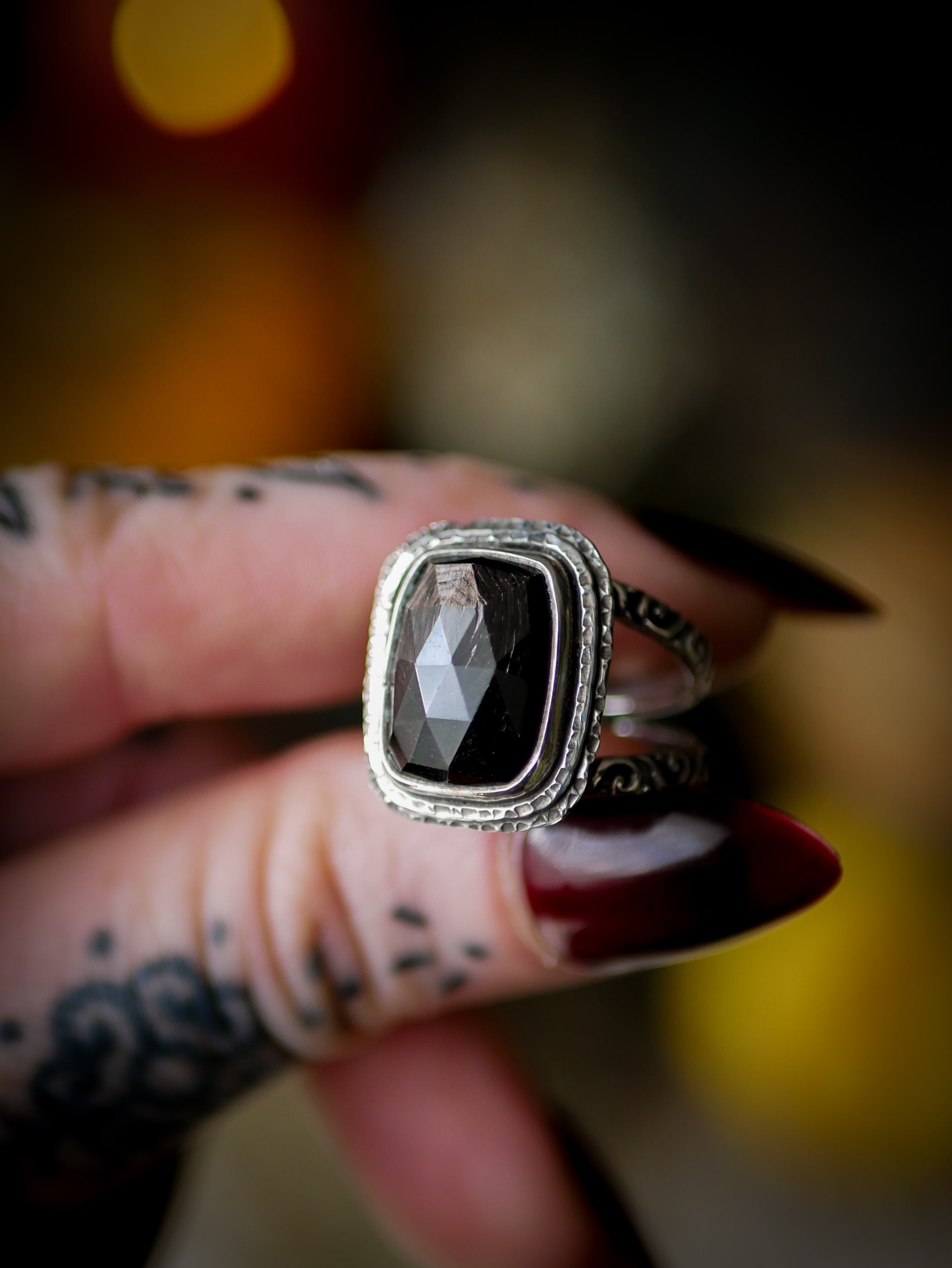 Persephone's Gate - Faceted hypersthene and silver ring, forged skull on the back
