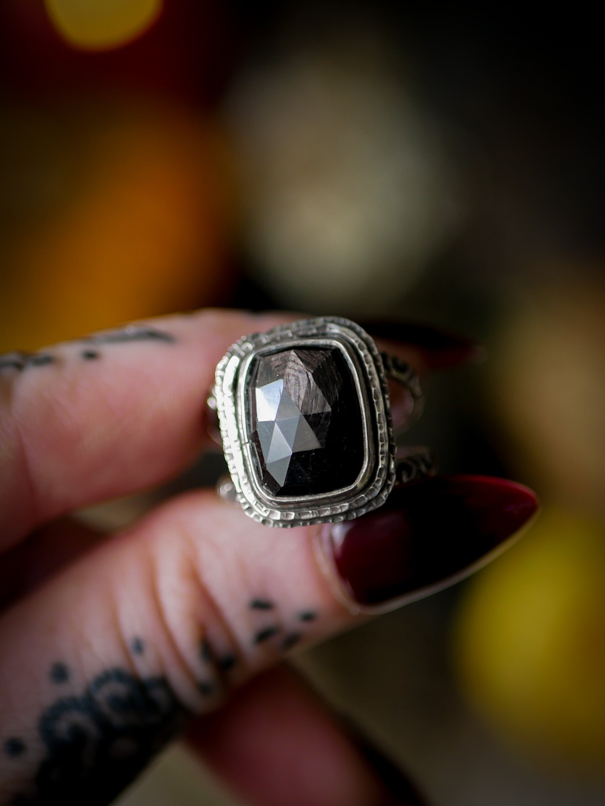 Persephone's Gate - Faceted hypersthene and silver ring, forged skull on the back