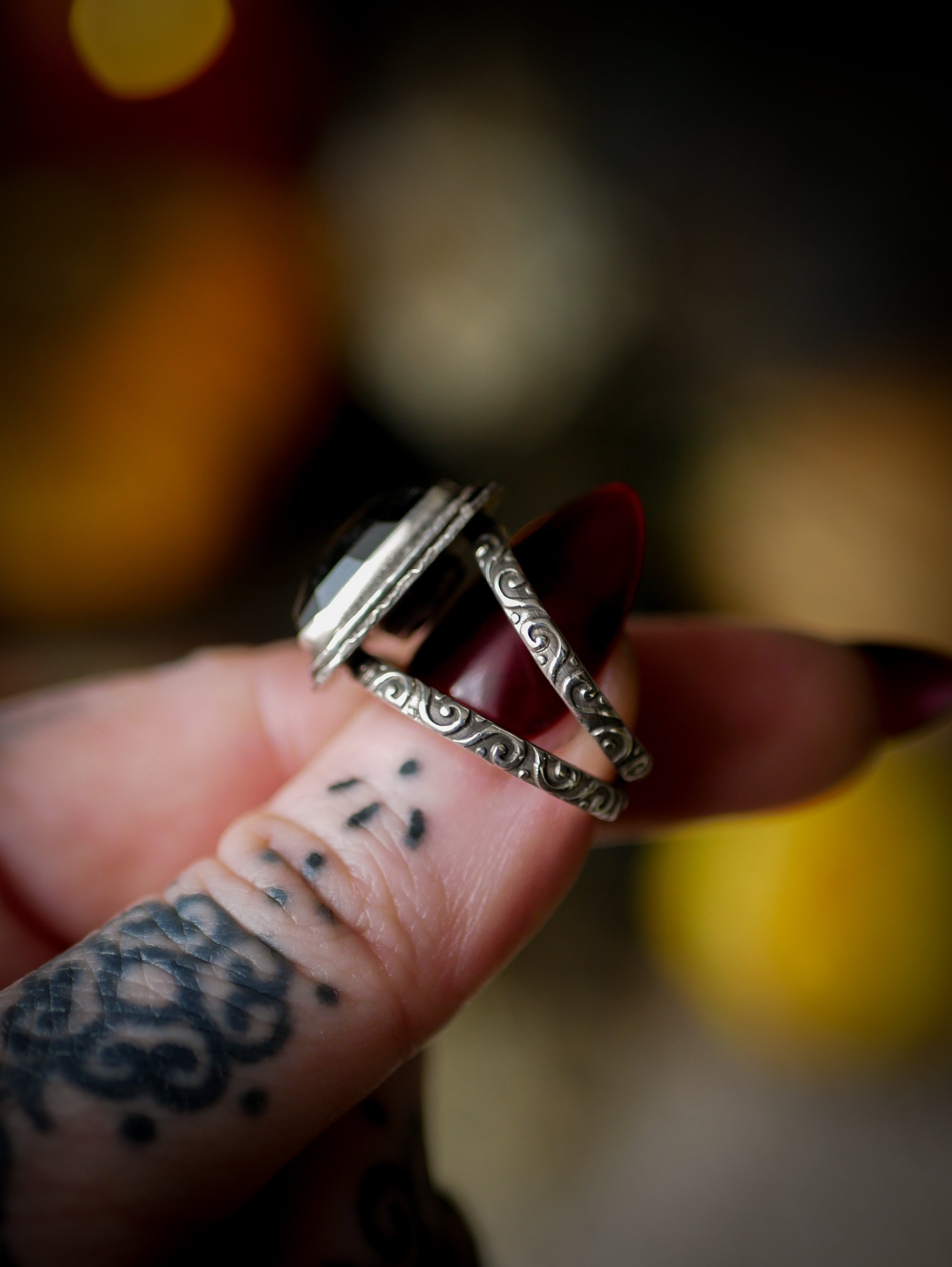 Persephone's Gate - Faceted hypersthene and silver ring, forged skull on the back
