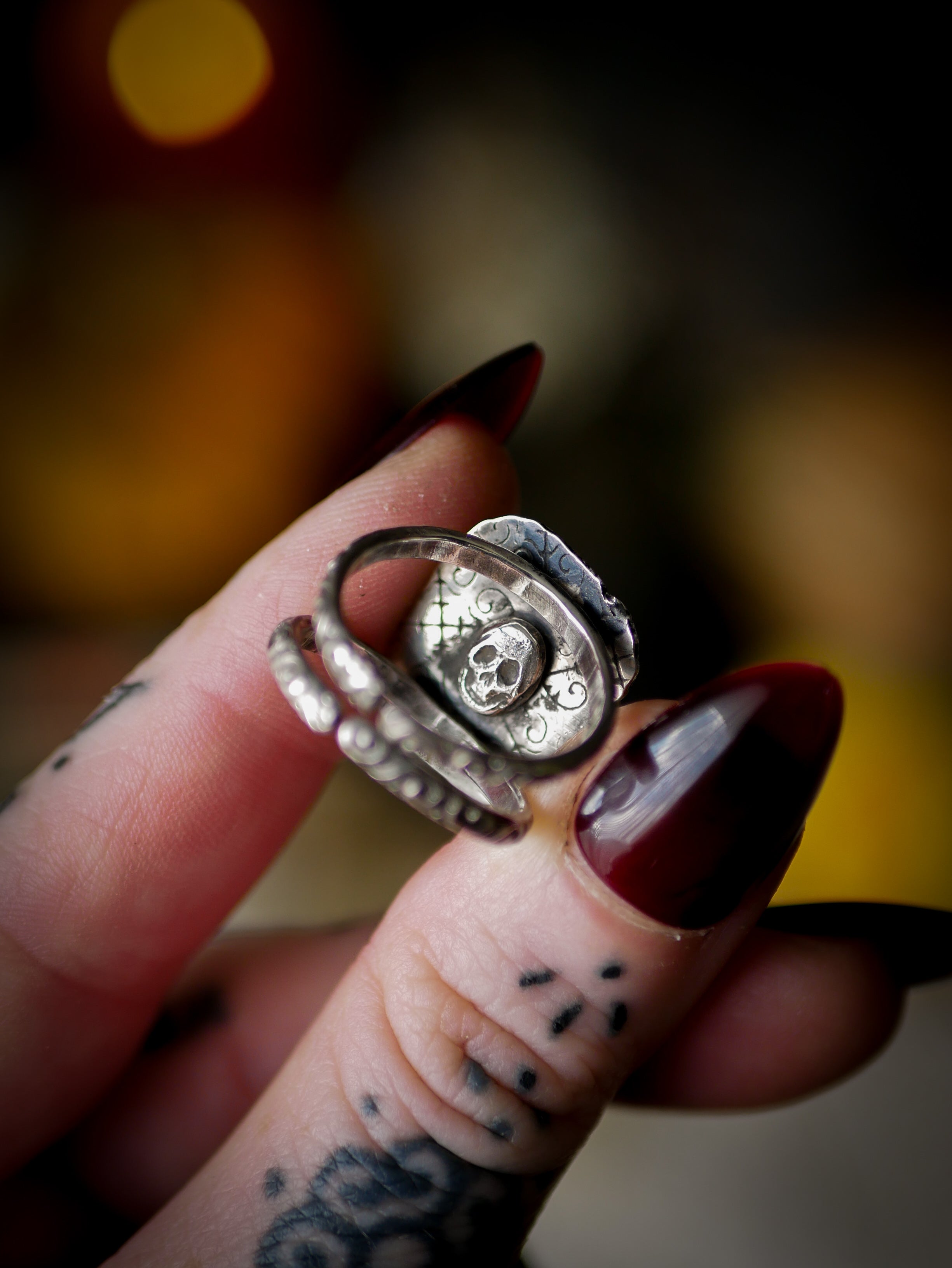 Persephone's Gate - Faceted hypersthene and silver ring, forged skull on the back
