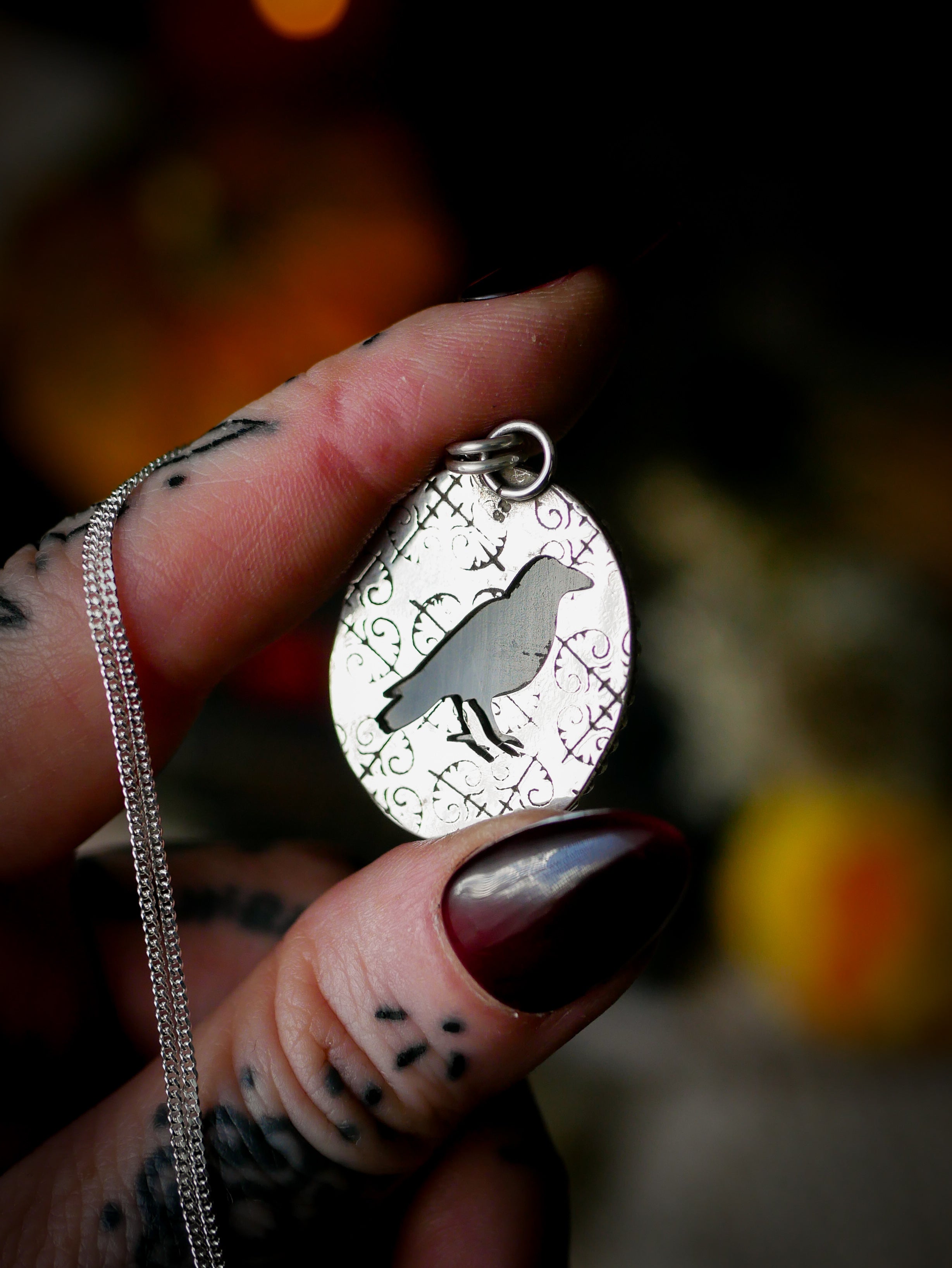 The Omen - Faceted black onyx and silver necklace, raven on the back
