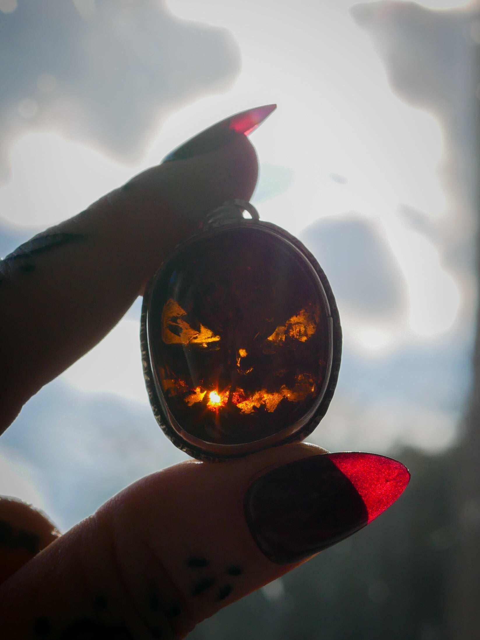 Jack O'Lantern - Baltic amber and silver necklace, Jack O'Lantern on the back
