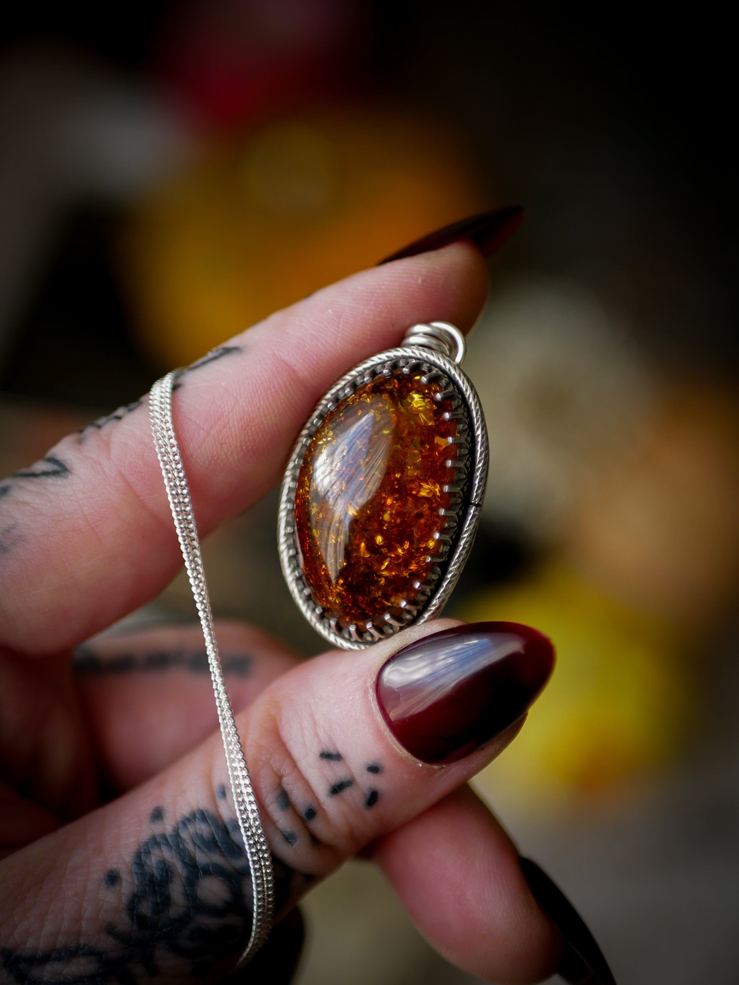 The Veil - Baltic amber and silver necklace, chrysanthemum on the back