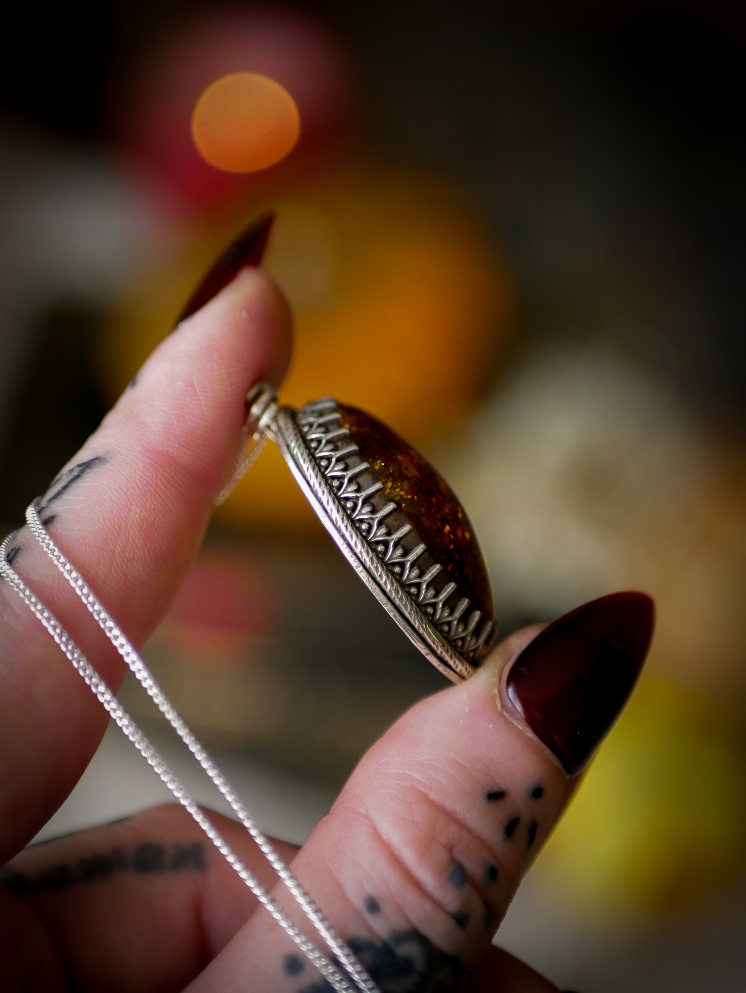 The Veil - Baltic amber and silver necklace, chrysanthemum on the back