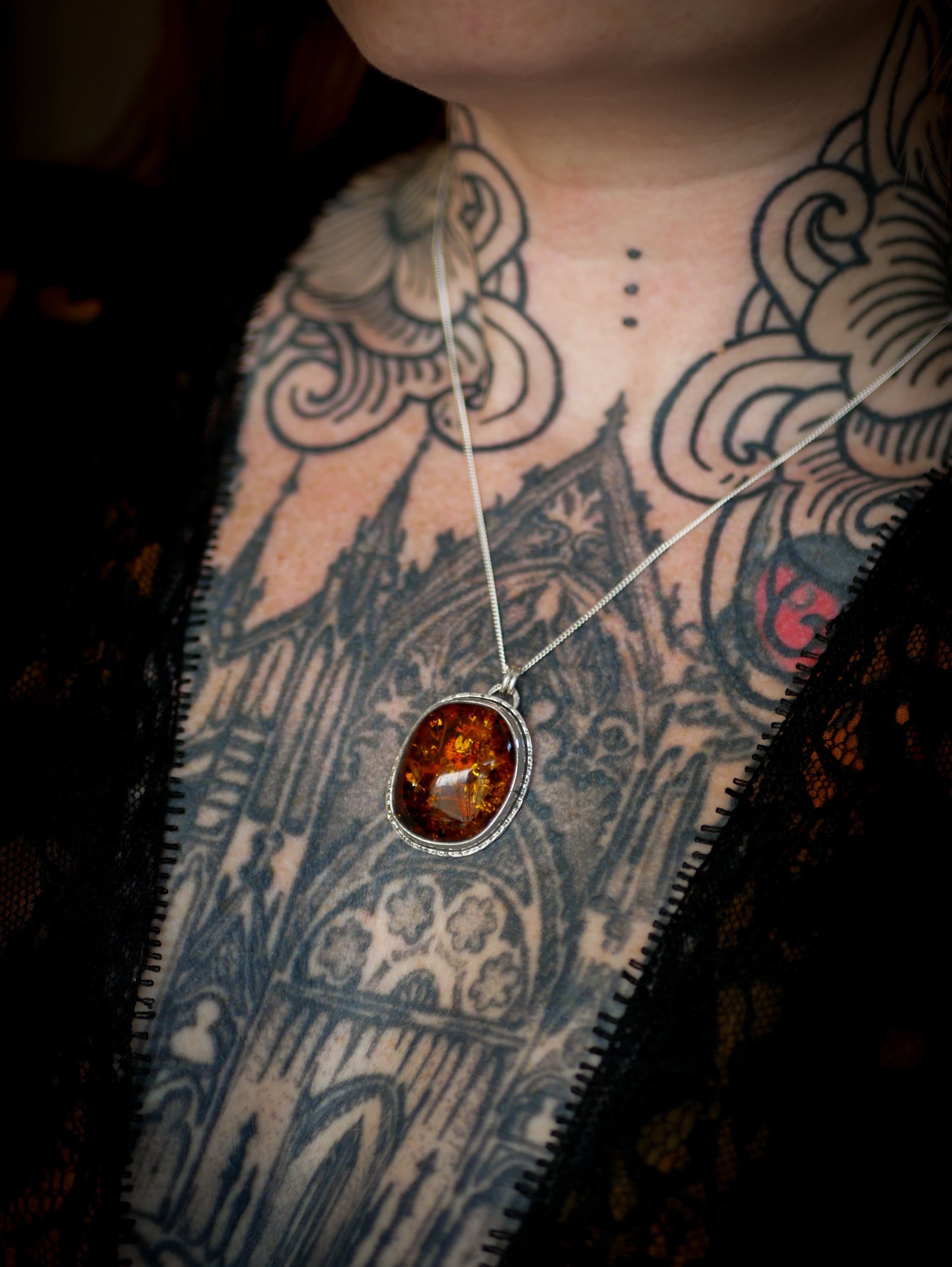 Jack O'Lantern - Baltic amber and silver necklace, Jack O'Lantern on the back
