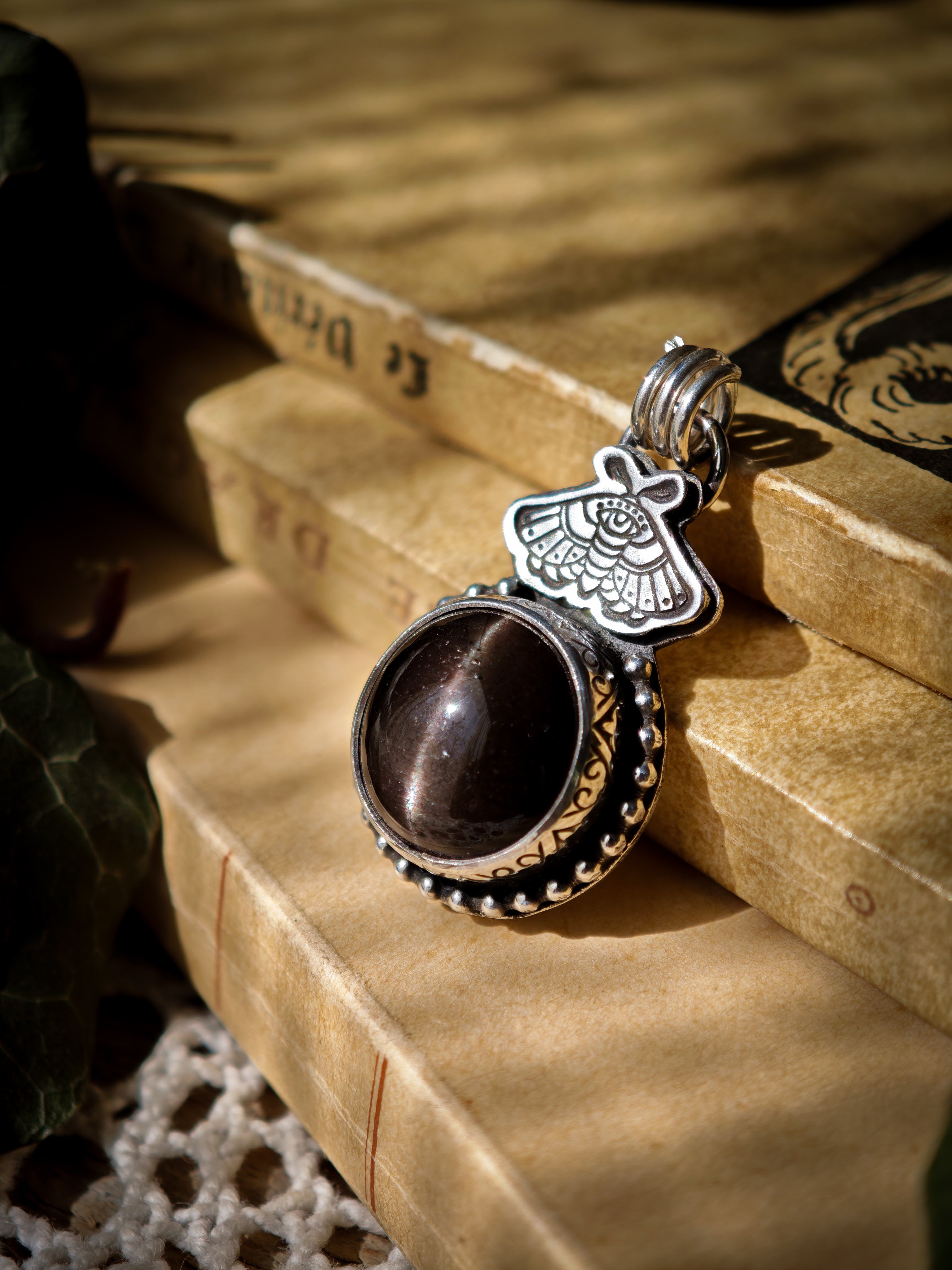 Divination - Scapolite and silver pendant, butterfly embossed