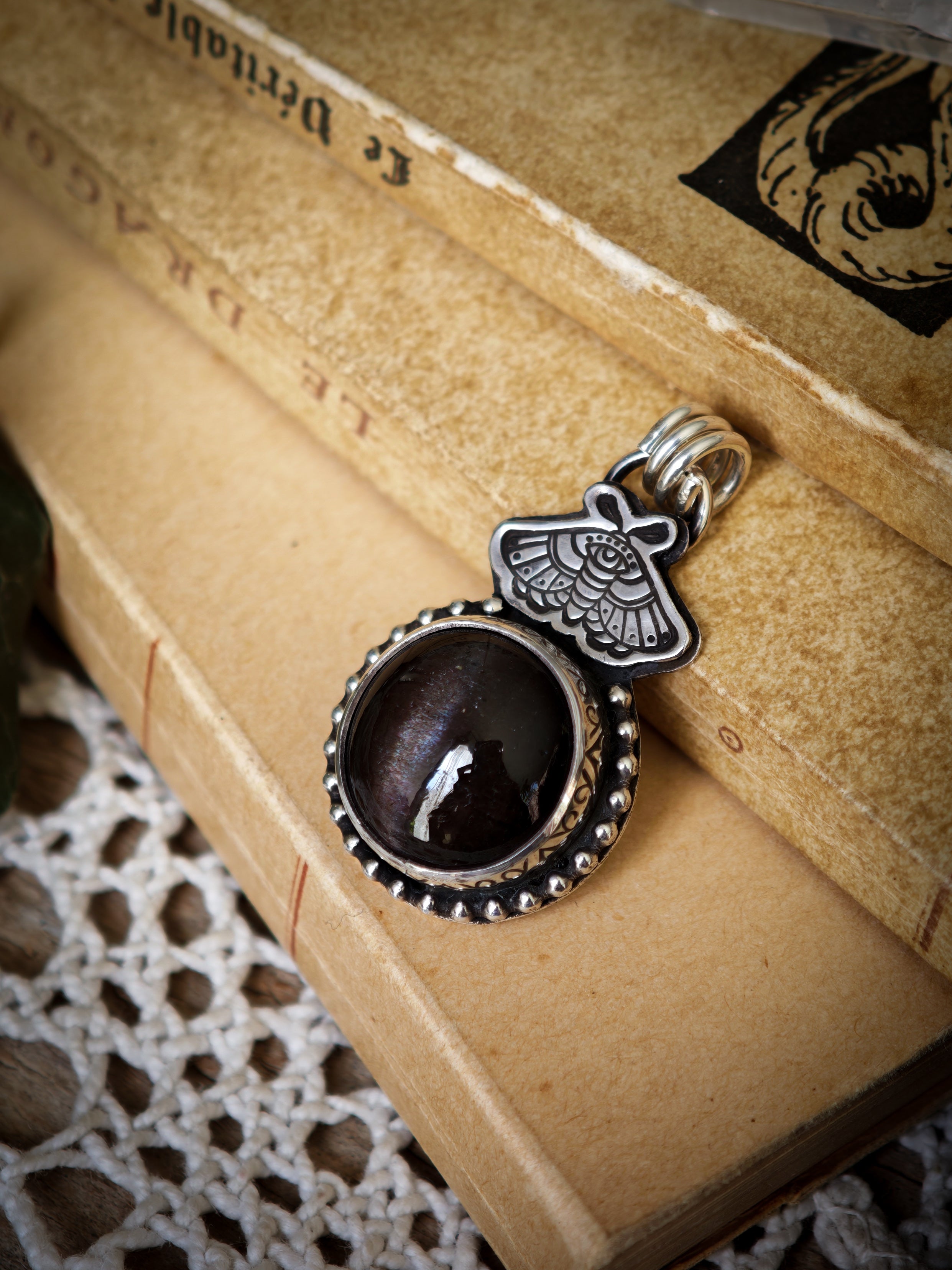 Divination - Scapolite and silver pendant, butterfly embossed