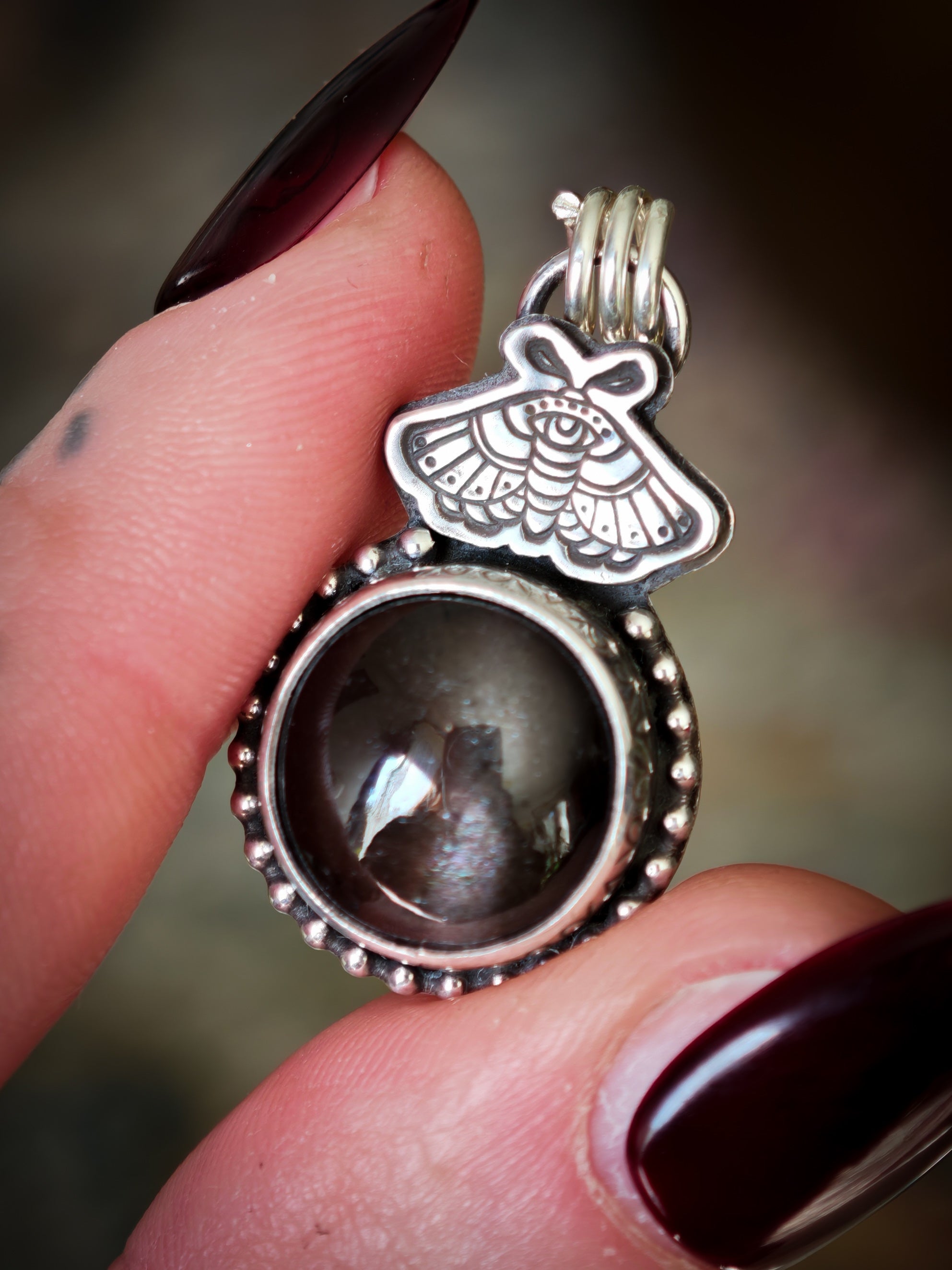Divination - Scapolite and silver pendant, butterfly embossed