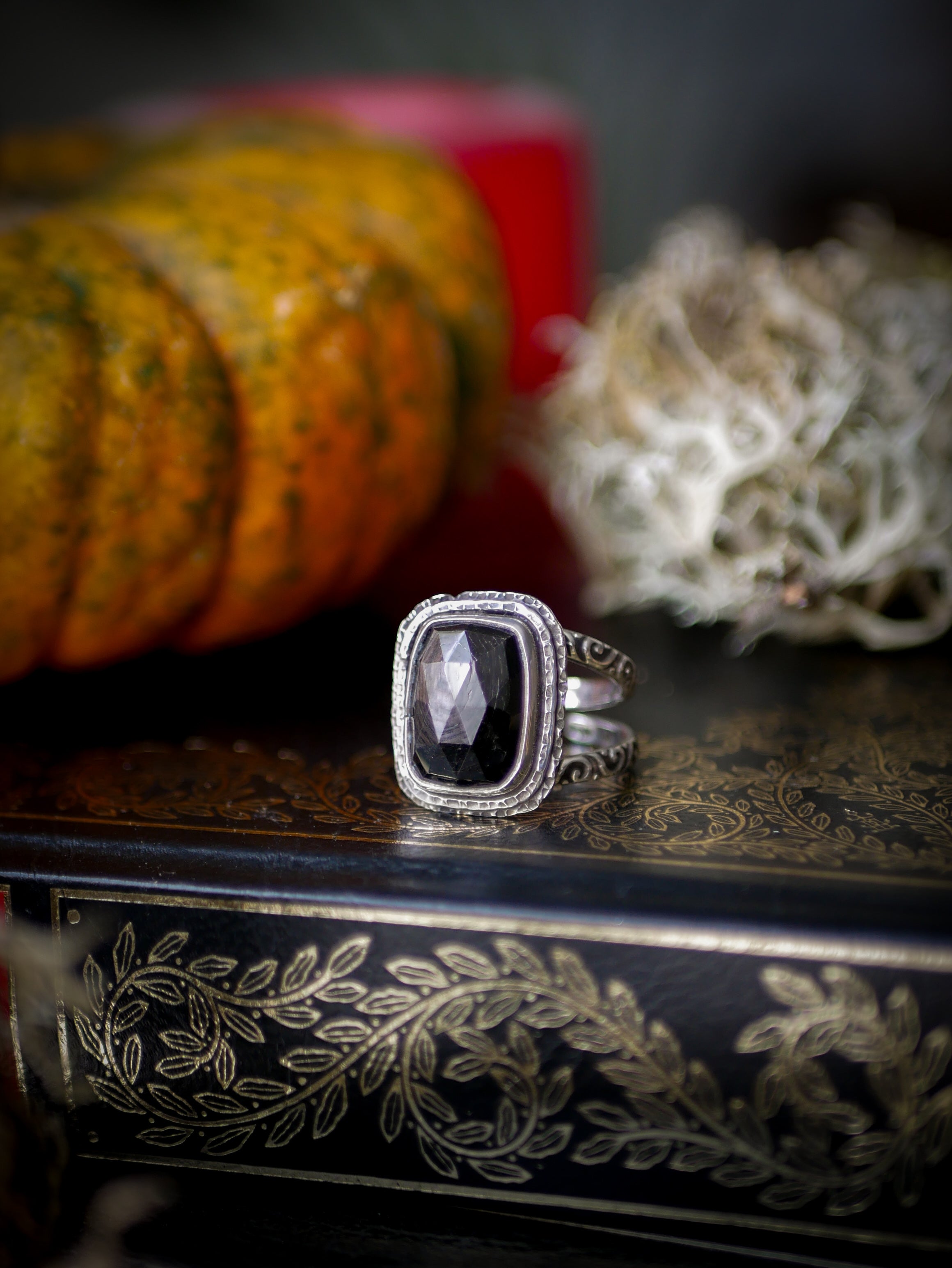 Persephone's Gate - Faceted hypersthene and silver ring, forged skull on the back