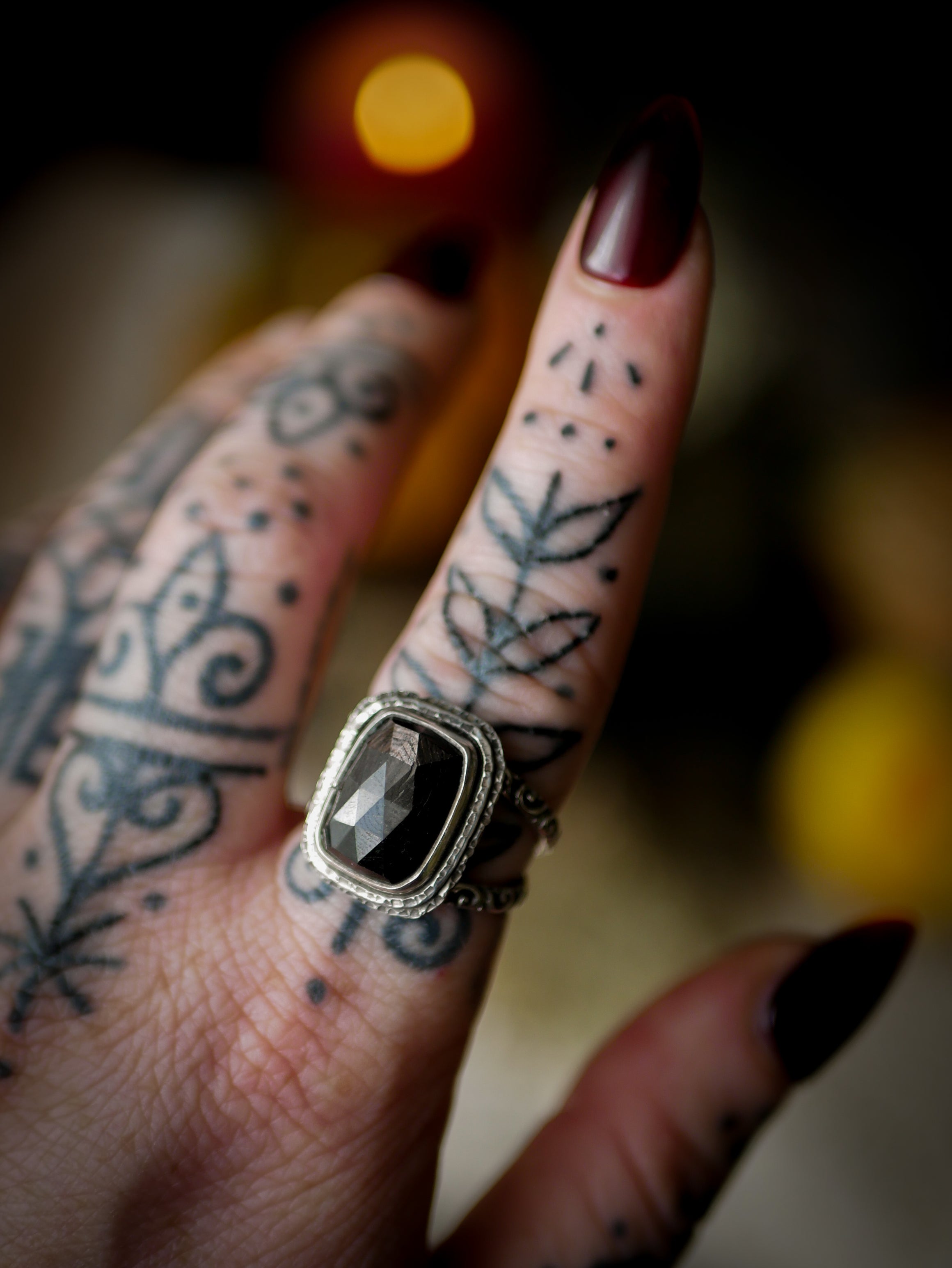 Persephone's Gate - Faceted hypersthene and silver ring, forged skull on the back
