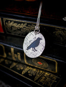 The Omen - Faceted black onyx and silver necklace, raven on the back
