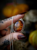 Jack O'Lantern - Baltic amber and silver necklace, Jack O'Lantern on the back