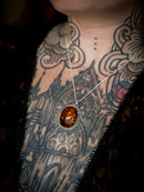 Jack O'Lantern - Baltic amber and silver necklace, Jack O'Lantern on the back